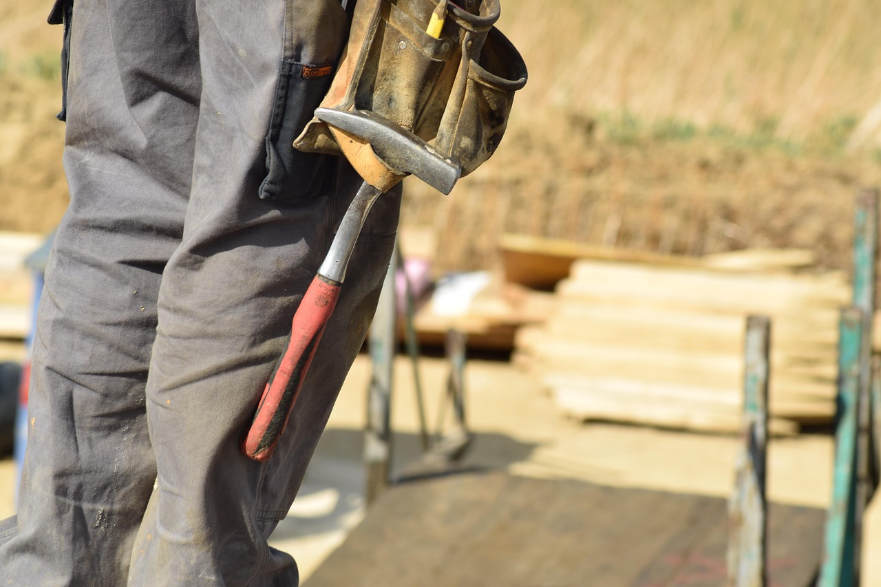 Professional construction tools and equipment on workbench for roofing projects